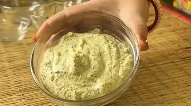 Bhetki Paturi wrapped in banana leaves, coated with mustard paste